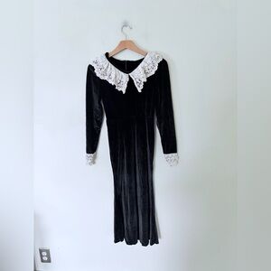 black velvet midi dress featuring a large white lace collar and lace-trimmed cuf